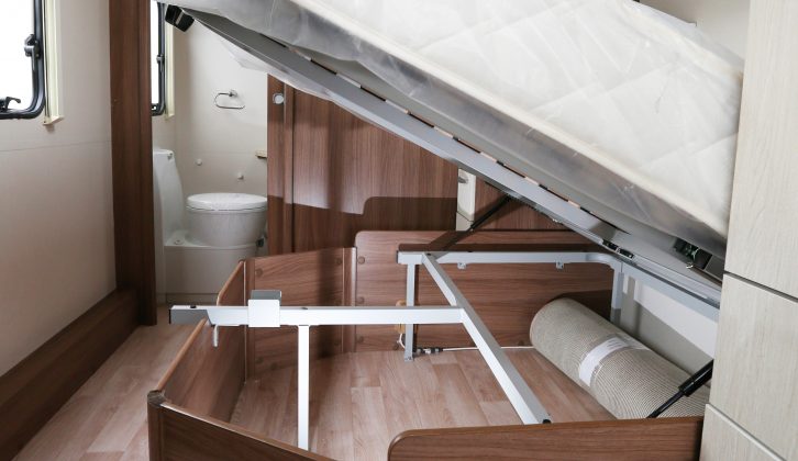The fixed bed lifts up to provide access to a capacious storage area