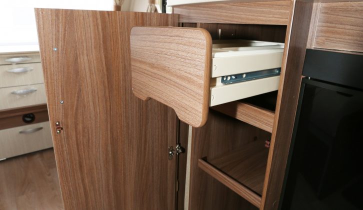 Concealed behind a door next to the Venus 570/4's fridge are cupboards and a drawer