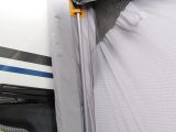 The awning is sealed to the caravan’s side with poles and padding