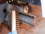 Thoroughly clean the rollers using a wire brush and check for loose or damaged areas