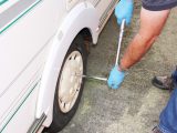 At the end of the regritting process, replace the caravan's wheels and torque the wheel bolts