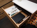 The sideboard's drawers are usefully wide and the upper one has a cutlery tray