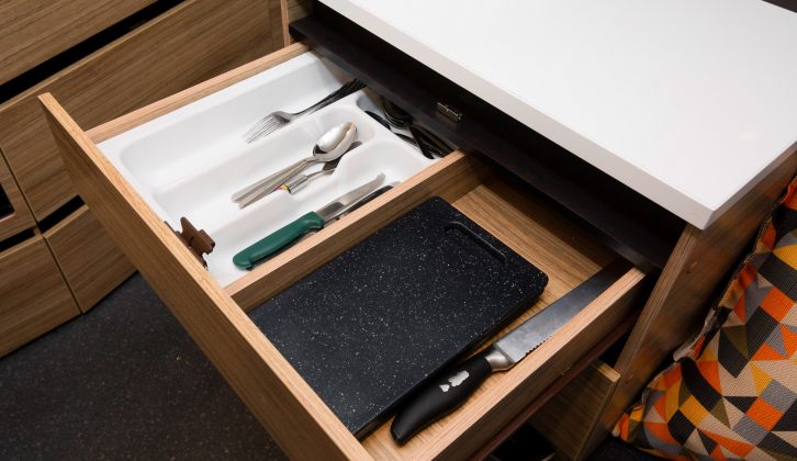 The sideboard's drawers are usefully wide and the upper one has a cutlery tray