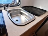 The end kitchen has a stainless-steel sink with a clip-on drainer – and in this van, the oven and hob were as good as new!