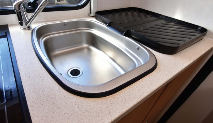 The end kitchen has a stainless-steel sink with a clip-on drainer – and in this van, the oven and hob were as good as new!