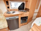 There's a combined oven and grill, a 107-litre Thetford fridge and a good-sized, stainless steel sink in this tourer's kitchen