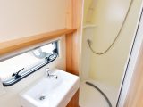 There's a well-proportioned hand basin under the window in this Bailey Orion 430/4's full-width end washroom