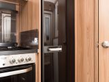 This dual-fuel tall fridge with freezer compartment sits alongside the main kitchen area