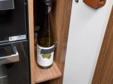 Cupboard space in the Bailey Unicorn Cabrera includes a wine rack