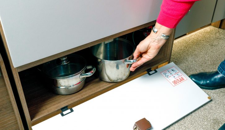 Pans can be accommodated in this shelved cupboard