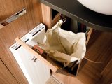 While this pull-out laundry basket is a neat and thoughtful touch, this one might be a little small