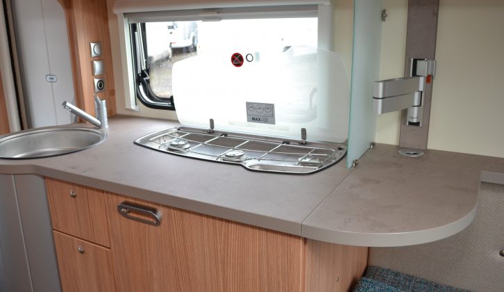 A screen prevents splashing from items on the three-burner hob and there's a worktop extension flap