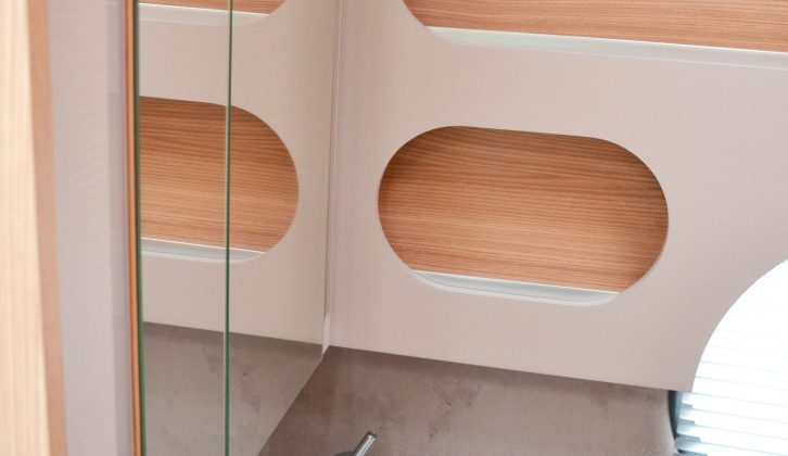 There's yet more storage behind these mirrored cupboard doors and in those sharp-looking shelves