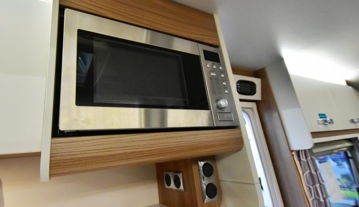 The microwave is not fitted as standard, it comes with the Diamond Pack (£595)