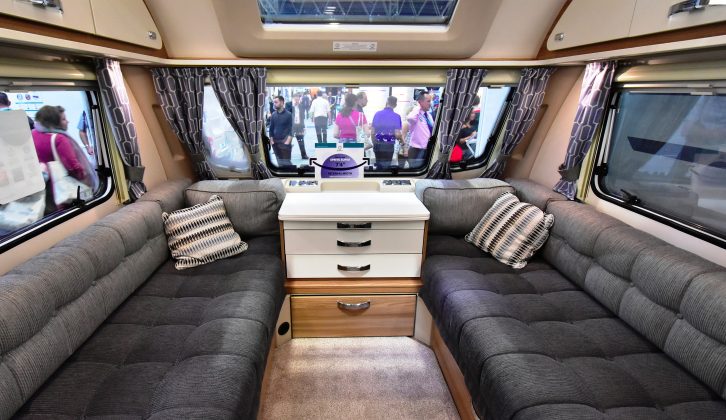 This twin-axle tourer's lounge has deep sofas and can easily accommodate six – USB ports are included in the bank under the central window