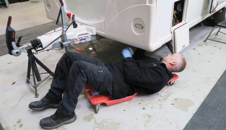 The technician checks that all bolts are tight, greases components and ensures that pipes aren’t cracked underneath the caravan