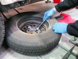Tyre walls are assessed for cracks and the spare wheel is checked