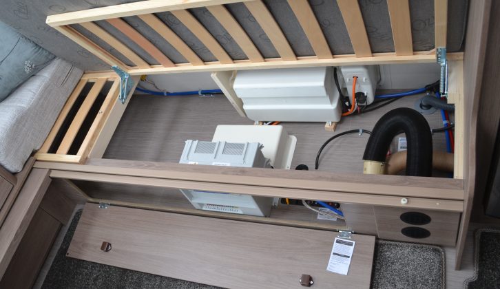 Access to the storage space under the sofas is via flaps or by pushing the slats up, which are on gas struts