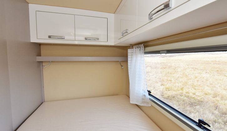 The 1.87 x 1.28/80m French bed has a large window with a blind and domestic-style curtains, as well as overhead lockers, a shelf and two adjustable reading lights