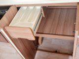 You'll find a large, shelved cupboard and this cutlery drawer beneath the kitchen worktop