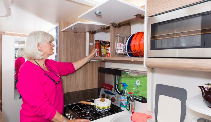 The well-equipped kitchen has a Thetford three-burner hob, an oven and a grill