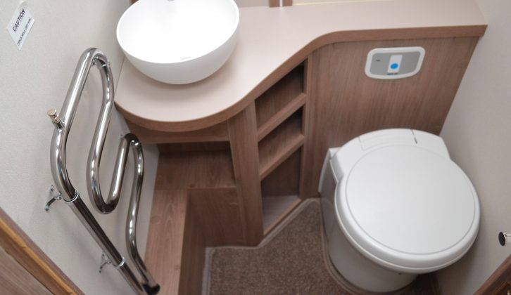 The offside area of the central washroom has an Alde-heated towel radiator, plus a salad-bowl sink and a toilet