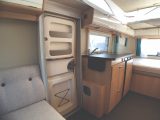 Single-piece entrance door on the Eriba Touring Troll 530 '60 Edition' has handy storage solutions in the top and bottom sections