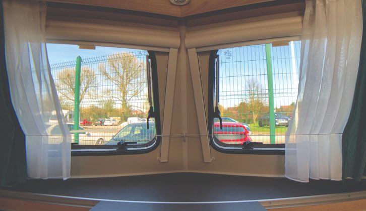 Split windows in a V-shape at the front of the Eriba Touring Troll 530 '60 Edition' have a handy ledge for placing everyday items, plus space in small recesses below