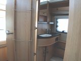 The inside surface of the washroom door in the Eriba Touring Troll 530 '60 Edition' features some handy storage solutions including these towel rails