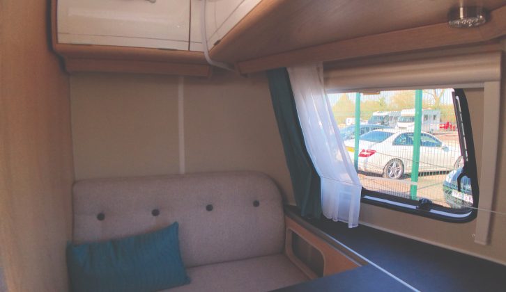 The front lounge in the Eriba Touring Troll 530 '60 Edition' will comfortably accommodate two adults, plus two small children. The light-weight dinette table attaches easily to the rail on the leading edge of the window ledge