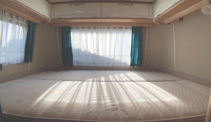 Comfortable cold foam mattress in the rear bedroom of the Eriba Touring Troll 530 '60 Edition'. It's low-set for easy ingress and egress