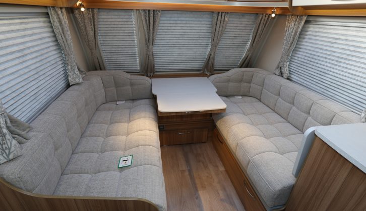 The classic Clubman look remains, with two parallel settees and wraparound
bolsters flanking the chest.