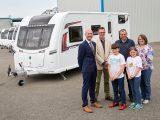 Elliot Hibbs of Coachman and our Niall Hampton present the Walker family with their brand new Coachman Vision 580