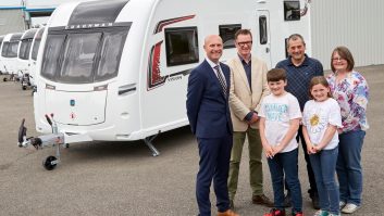 Elliot Hibbs of Coachman and our Niall Hampton present the Walker family with their brand new Coachman Vision 580