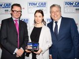Škoda's Michelle Henniker collects the award for the best car weighing up to 1400kg - the Škoda Octavia Hatch - in the Tow Car Awards 2018, from Practical Caravan's editor, Niall Hampton, and co-host James Cannon