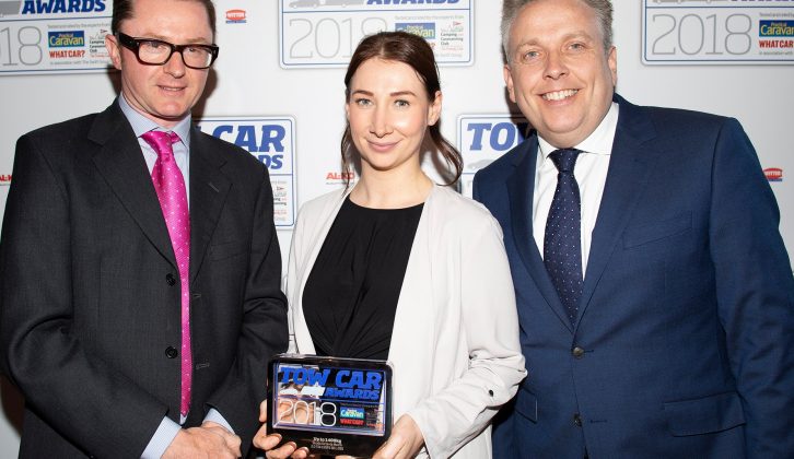 Škoda's Michelle Henniker collects the award for the best car weighing up to 1400kg - the Škoda Octavia Hatch - in the Tow Car Awards 2018, from Practical Caravan's editor, Niall Hampton, and co-host James Cannon