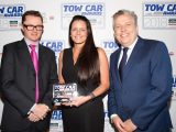 Škoda's Nikki Pates collects the award for the best car weighing between 1400-1549kg - the Škoda Superb - in the Tow Car Awards 2018, from Practical Caravan's editor, Niall Hampton, and co-host James Cannon