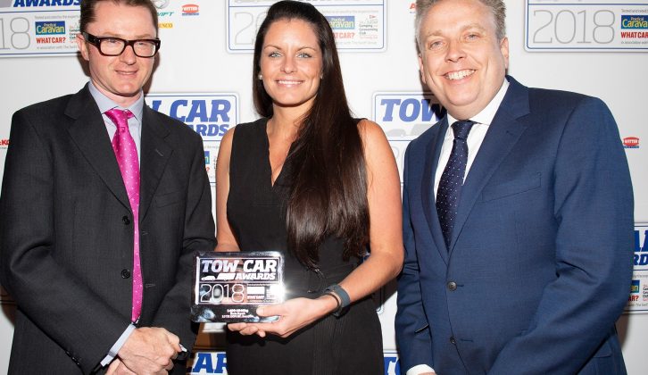 Škoda's Nikki Pates collects the award for the best car weighing between 1400-1549kg - the Škoda Superb - in the Tow Car Awards 2018, from Practical Caravan's editor, Niall Hampton, and co-host James Cannon