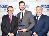 Peugeot's Mason Finney collects the award for the best car weighing 1550-1699kg - the Peugeot 5008 - in the Tow Car Awards 2018, from Practical Caravan's editor, Niall Hampton, and co-host James Cannon