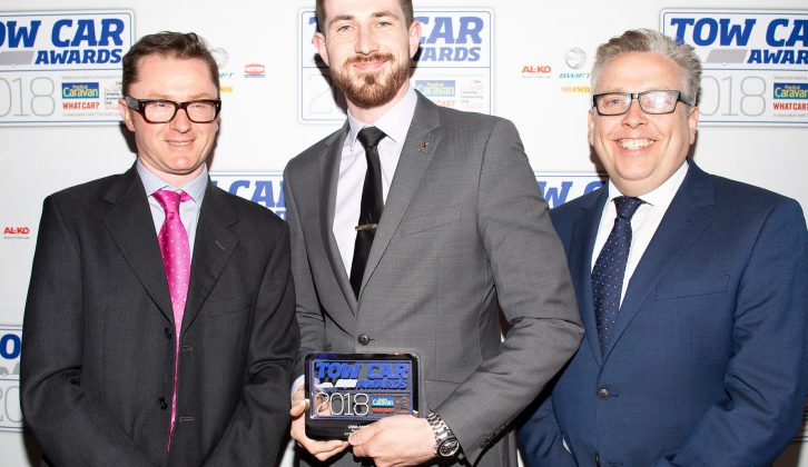 Peugeot's Mason Finney collects the award for the best car weighing 1550-1699kg - the Peugeot 5008 - in the Tow Car Awards 2018, from Practical Caravan's editor, Niall Hampton, and co-host James Cannon