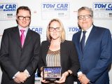 Volkswagen's Nikki Divey collects the award for the Best Ultralight Tow Car - the Volkswagen Polo -
 in the Tow Car Awards 2018, from Practical Caravan's editor, Niall Hampton, and co-host James Cannon
