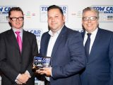 Hyundai's Robin Hayles collects the Fuel Economy Award for the Hyundai i30 Tourer in the Tow Car Awards 2018, from Practical Caravan's editor, Niall Hampton, and co-host James Cannon
