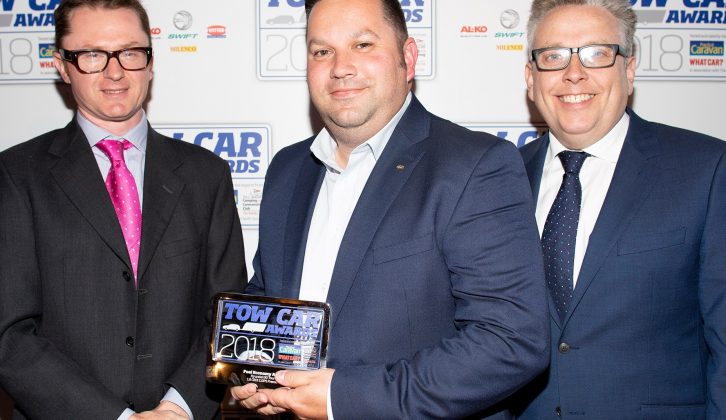 Hyundai's Robin Hayles collects the Fuel Economy Award for the Hyundai i30 Tourer in the Tow Car Awards 2018, from Practical Caravan's editor, Niall Hampton, and co-host James Cannon