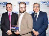 Volvo's Ben Foulds collects the Best Family SUV award for the Volvo XC40 at the Tow Car Awards 2018, from Practical Caravan's editor, Niall Hampton, and co-host James Cannon