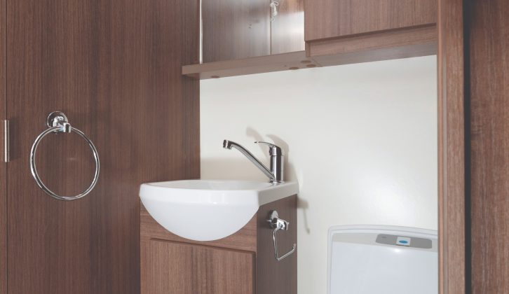 The central washroom splits across the Bailey Phoenix 640, with toilet and vanity unit on one side and a shower on the other