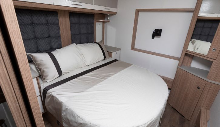 The master bedroom of the Coachman Laser 650 features an offside-mounted transverse island bed with a recess in the back wall for hanging a flatscreen TV