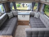 A closer look at the spacious parallel lounge in the Swift Elegance 635. 'Darwin' soft furnishings take pride of place next to the 'Aralie Sen' cabinetwork