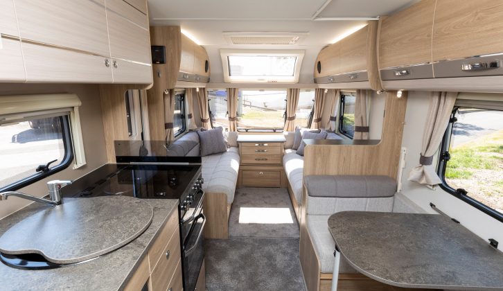 The midships kitchen in the 2019 Elddis Avanté 586 overlooks an offside dinette fitted with a Pullman bunk