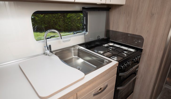 The Compass Camino 674's kitchen comes with a dual-fuel cooker, for maximum flexibility on tour, a separate oven and grill and a sink with smart mixer tap