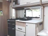 The well-equipped kitchen is compact but makes good use of the space available